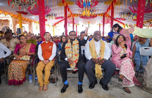 President Dr Irfaan Ali and Prime Minister Mark Phillips with devotees at the event on Wednesday