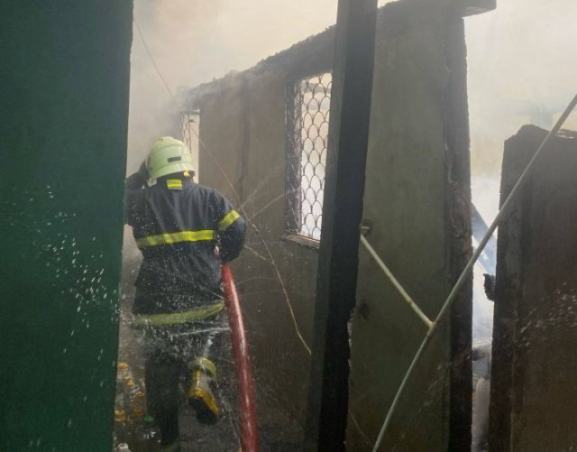 A firefighter battling the blaze