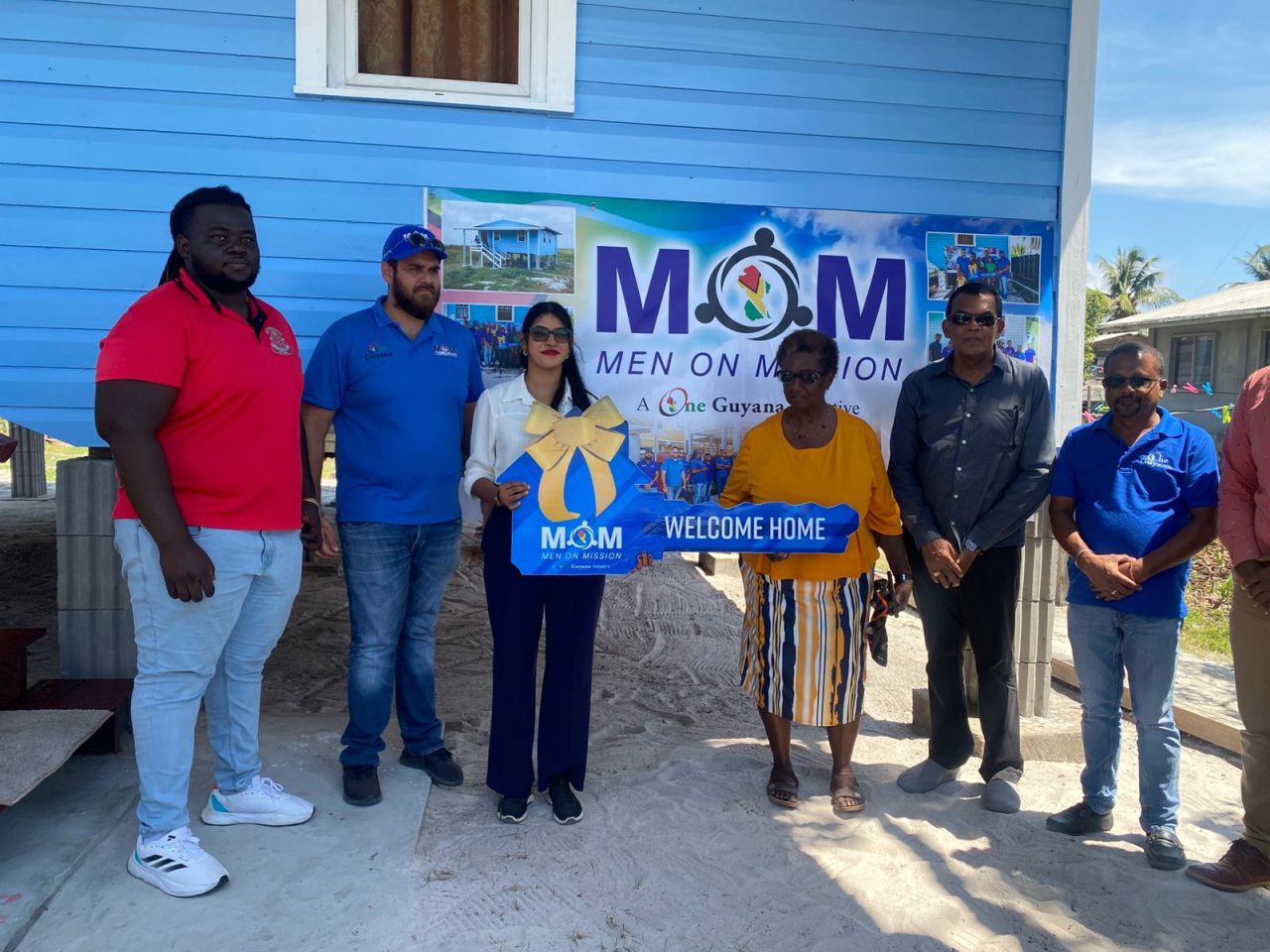 Keys to happiness: four families receive homes through Men on Mission