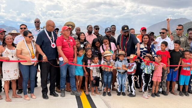 The cutting of the ceremonial ribbon to officially open the airstrip