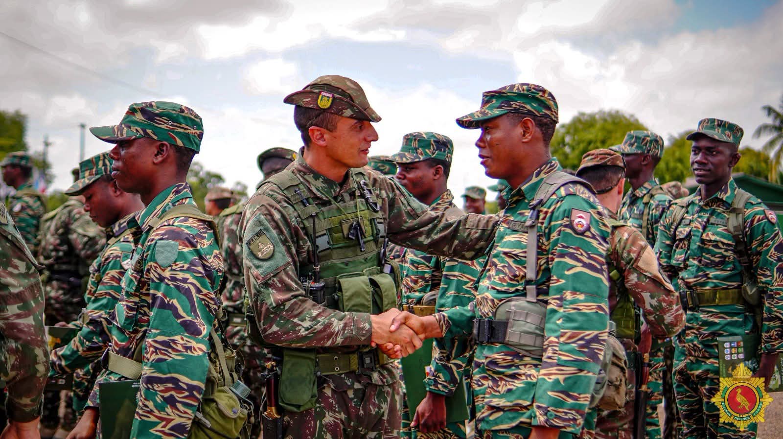 Soldiers from the two countries shake hands